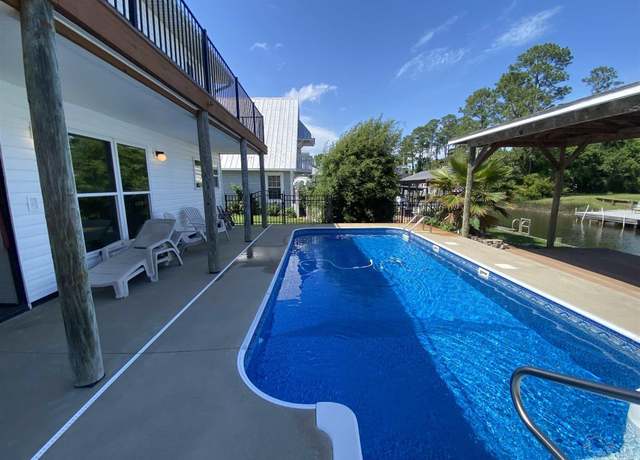 Property at 1628 College Pkwy, Gulf Breeze, FL 32563, 4 beds, 3.5 baths