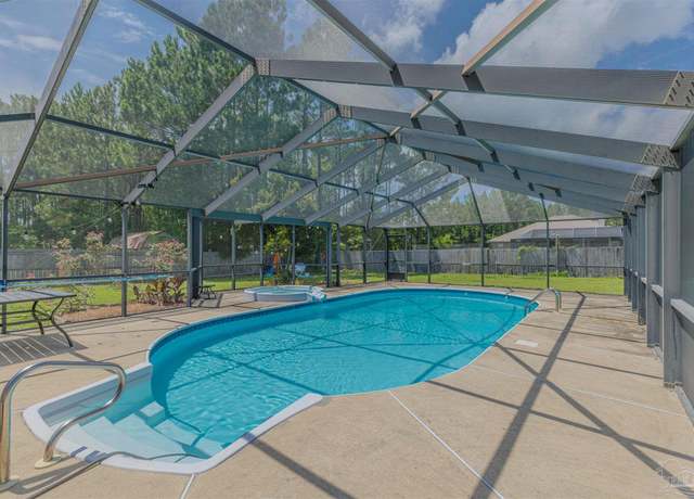 Property at 7358 Brevard St, Navarre, FL 32566, 4 beds, 3 baths