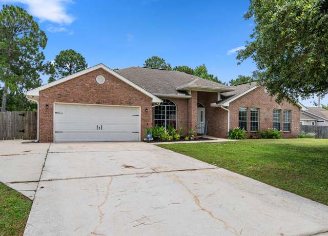 Property at 6605 Kempton St, Navarre, FL 32566, 4 beds, 3 baths