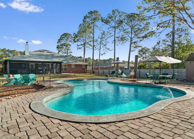 Property at 7044 Sawfish St, Navarre, FL 32566, 5 beds, 3 baths