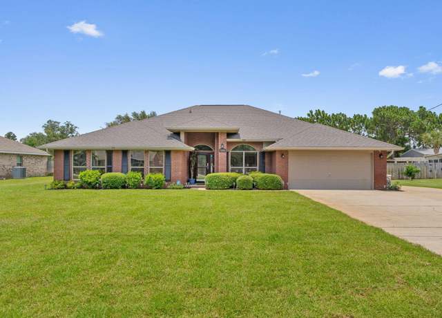 Property at 7302 Manatee St, Navarre, FL 32566, 4 beds, 3 baths