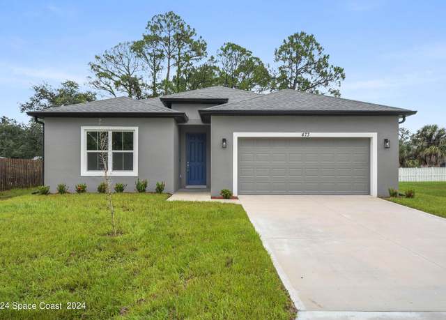 Property at 473 Tropicaire Ave SW, Palm Bay, FL 32908, 4 beds, 3 baths