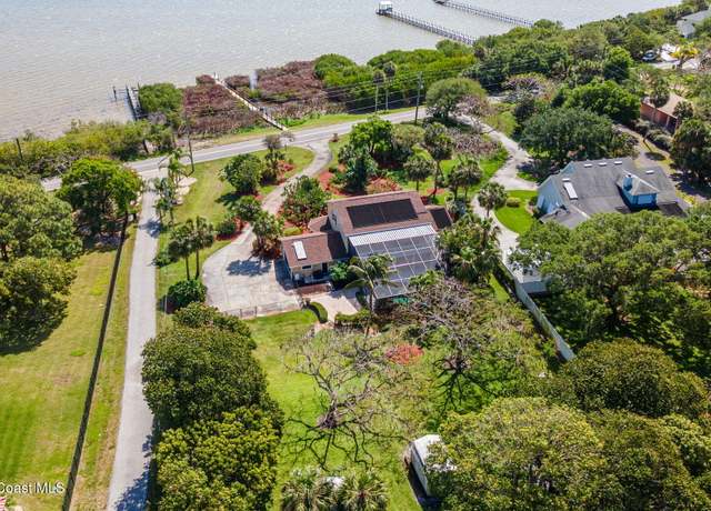 Property at 7055 S Tropical Trl, Merritt Island, FL 32952, 4 beds, 3 baths
