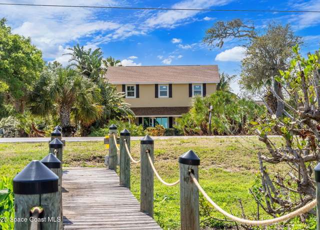 Property at 7055 S Tropical Trl, Merritt Island, FL 32952, 4 beds, 3 baths