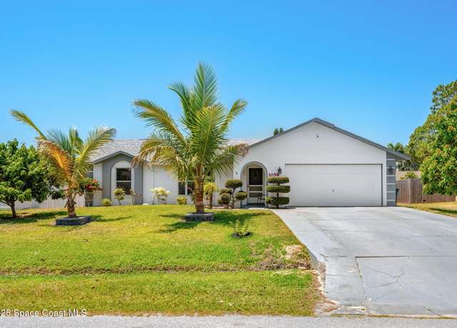 Property at 1058 Sheridan Ave NW, Palm Bay, FL 32907, 4 beds, 2 baths