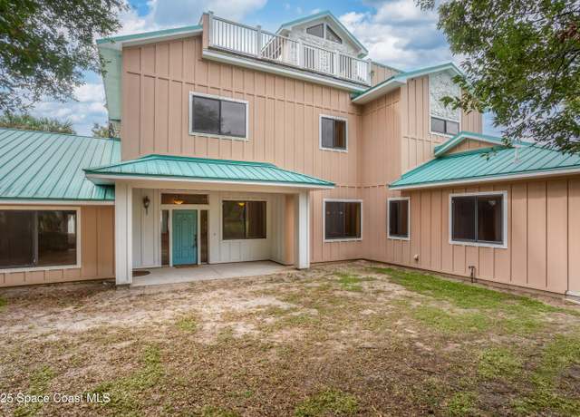 Property at 1437 N Tropical Trl, Merritt Island, FL 32953, 4 beds, 3.5 baths