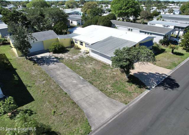 Property at 410 Egret Cir, Barefoot Bay, FL 32976, 2 beds, 2 baths