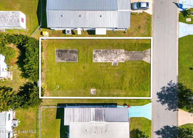 Property at 944 Thrush Cir, Barefoot Bay, FL 32976