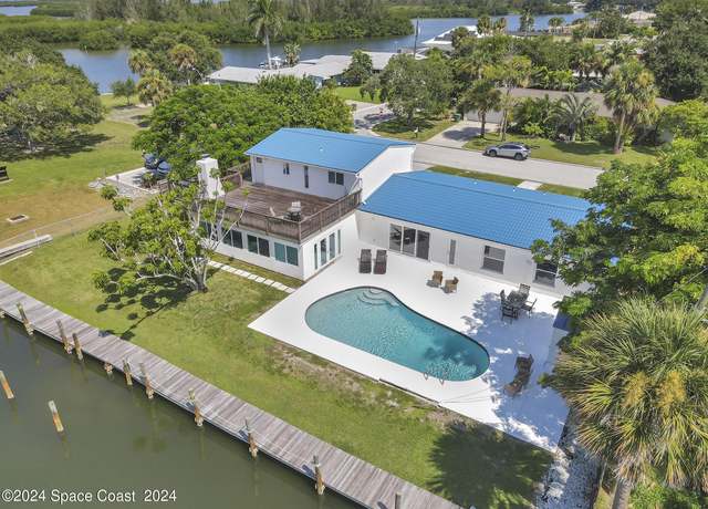 Property at 492 Dempsey Dr, Cocoa Beach, FL 32931, 5 beds, 4 baths