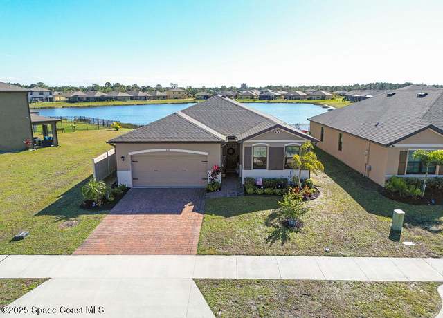 Property at 830 Remington Green Dr SE, Palm Bay, FL 32909, 4 beds, 2 baths