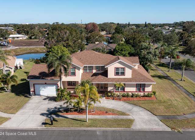 Property at 809 Champions Dr NE, Palm Bay, FL 32905, 5 beds, 4.5 baths