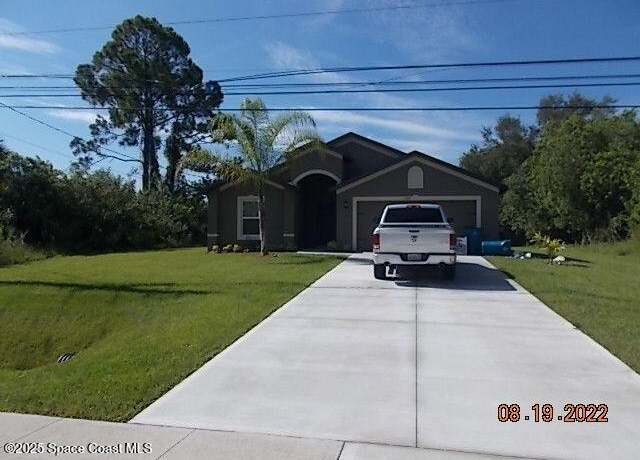 Property at 684 Osmosis Dr SW, Palm Bay, FL 32908, 4 beds, 2 baths