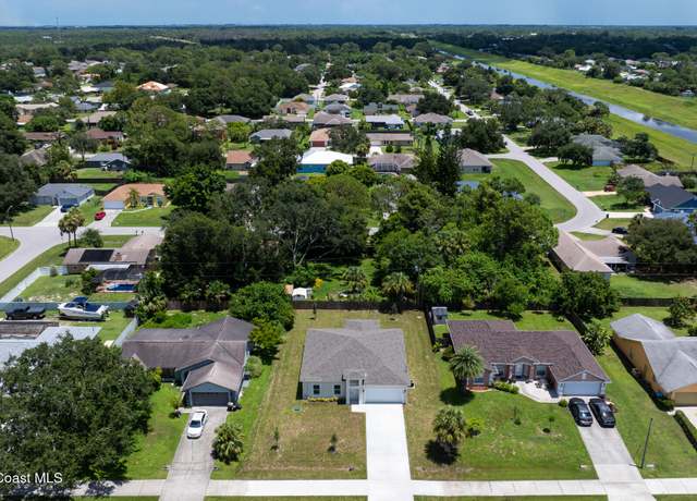 Property at 1105 Jupiter Blvd NW, Palm Bay, FL 32907, 3 beds, 3 baths