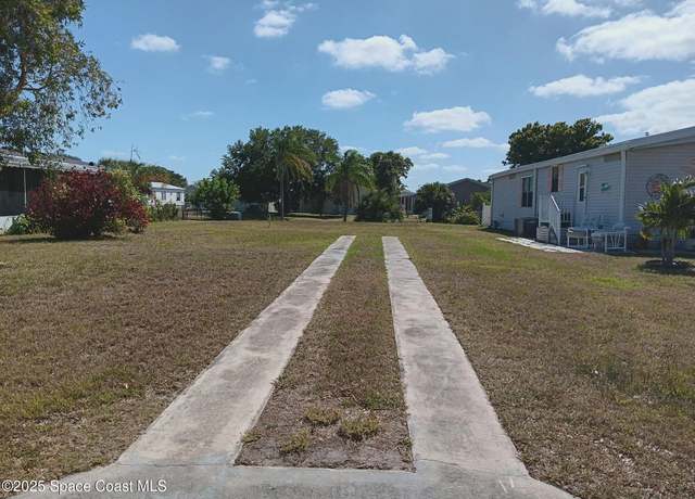 Property at 1105 Barefoot Cir, Barefoot Bay, FL 32976