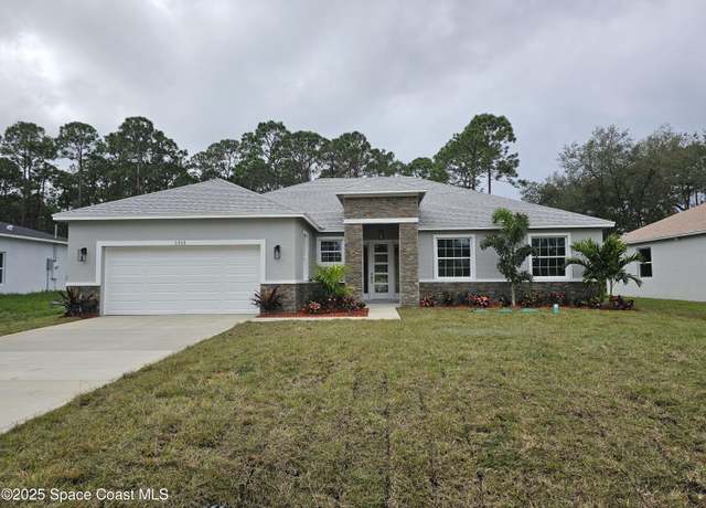 Property at 1312 Saxony Rd SW, Palm Bay, FL 32908, 4 beds, 3.5 baths