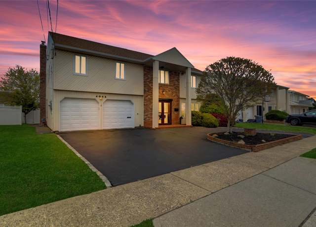 Property at 4042 Greentree Dr, Oceanside, NY 11572, 4 beds, 2.5 baths