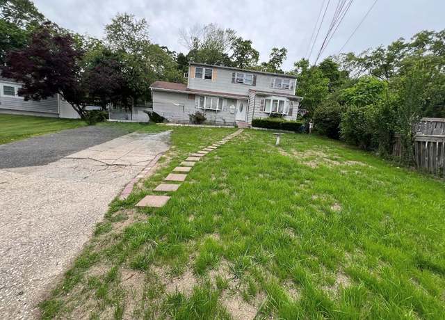 Property at 232 Sugarwood Ln, Central Islip, NY 11722, 4 beds, 2 baths