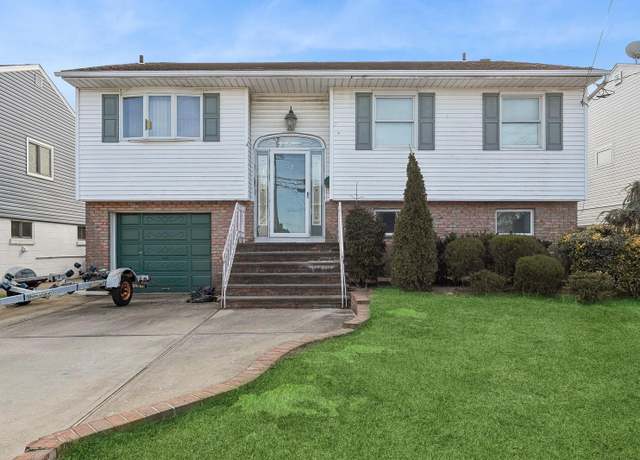 Property at 32 E 1st St, Freeport, NY 11520, 4 beds, 2 baths