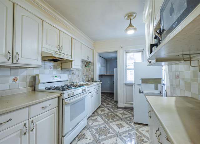 Property at 12406 111th Ave, South Ozone Park, NY 11420, 4 beds, 2 baths