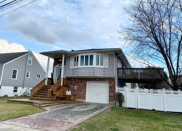 Property at 4081 Massachusetts Ave, Island Park, NY 11558, 4 beds, 3 baths