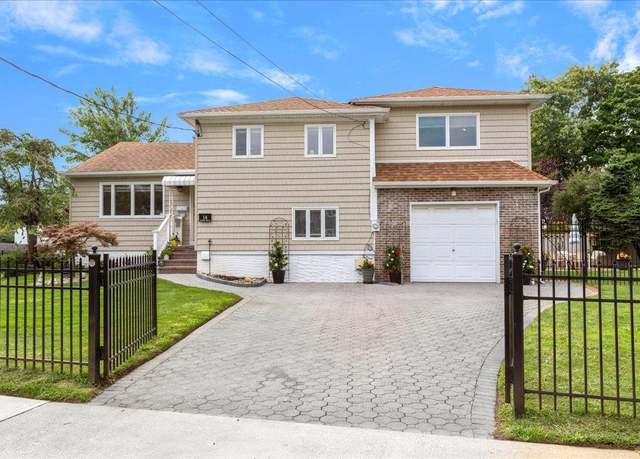 Property at 14 Soloff Blvd, Inwood, NY 11096, 4 beds, 3 baths