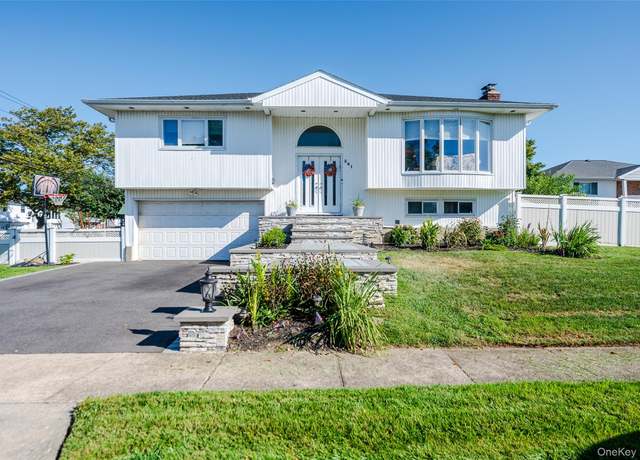 Property at 341 Green Ct, Oceanside, NY 11572, 4 beds, 3 baths