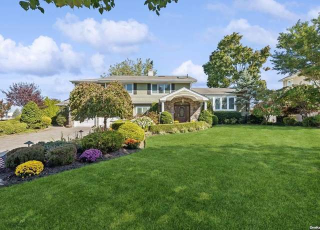 Property at 71 Overlea St E, Massapequa Park, NY 11762, 6 beds, 5.5 baths