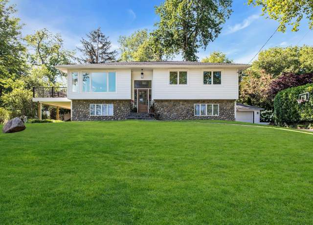 Property at 14 Tudor Dr, Northport, NY 11768, 4 beds, 3 baths