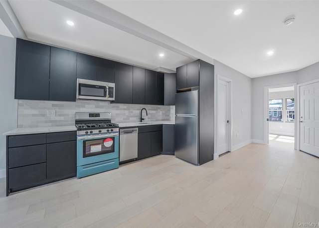 Property at 7518 95th Ave, Ozone Park, NY 11416, 4 beds, 2 baths