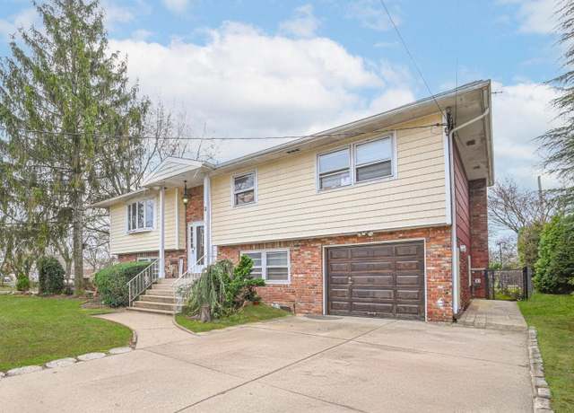 Property at 82 Coventry Gdns, Lynbrook, NY 11563, 5 beds, 2 baths