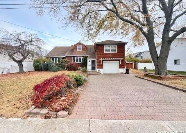 Property at 74 Madison Ave, Island Park, NY 11558, 4 beds, 2 baths