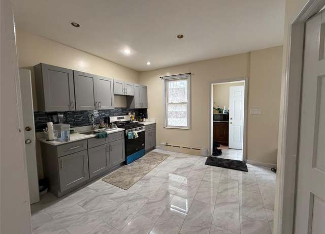 Property at 9507 239 St, Floral Park, NY 11001, 4 beds, 2.5 baths