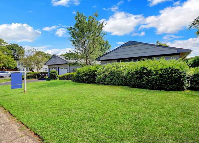 Property at 4 Tulip Grove Dr, Lake Grove, NY 11755, 3 beds, 2.5 baths