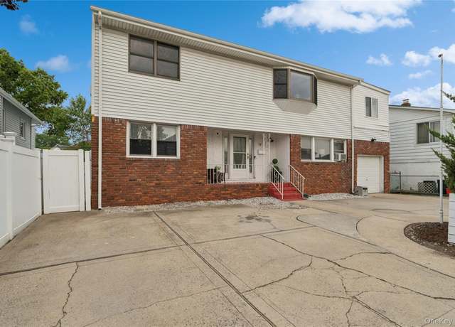 Property at 33 Newport Rd, Island Park, NY 11558, 6 beds, 2.5 baths
