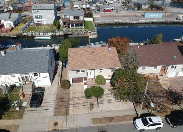Property at 69 E 1st St, Freeport, NY 11520, 4 beds, 2 baths