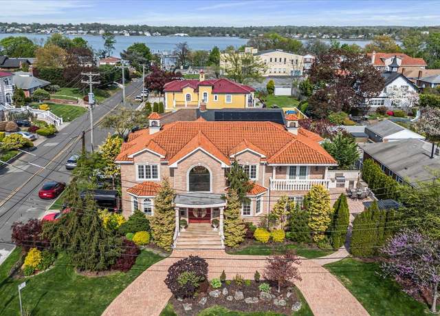 Property at 28-05 216th St, Bayside, NY 11360, 5 beds, 4 baths