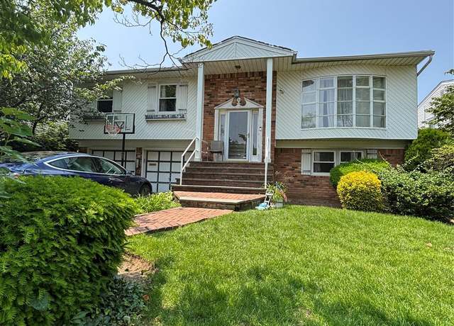 Property at 6 Valley Ln E, North Woodmere, NY 11581, 5 beds, 3 baths