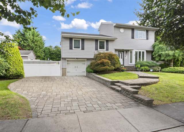 Property at 52 Pickwick Dr N, Syosset, NY 11791, 4 beds, 3 baths