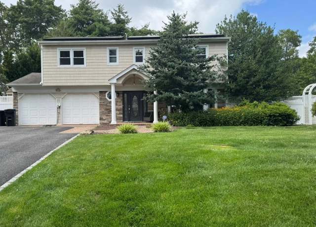 Property at 21 Tulipwood Dr, Commack, NY 11725, 4 beds, 2.5 baths