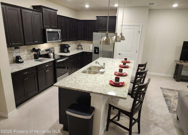Property at 1228 Blue Island Drive Dr, Clermont, FL 34714, 5 beds, 4 baths