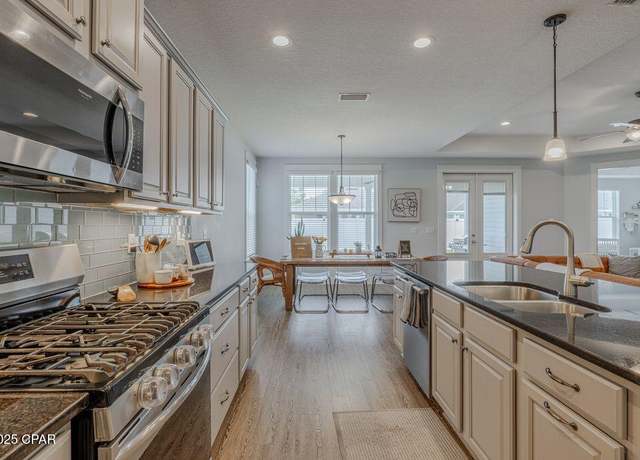 Property at 415 Warren Bayou Ln, Panama City Beach, FL 32407, 4 beds, 3 baths