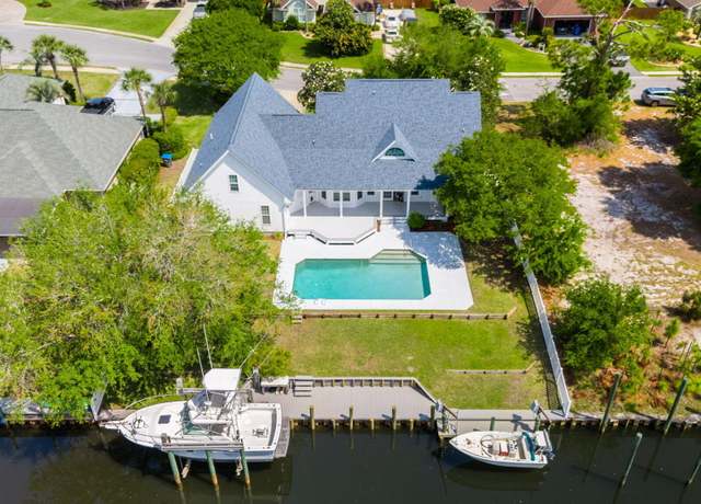 Property at 7107 Dolphin Bay Blvd, Panama City Beach, FL 32407, 5 beds, 4.5 baths