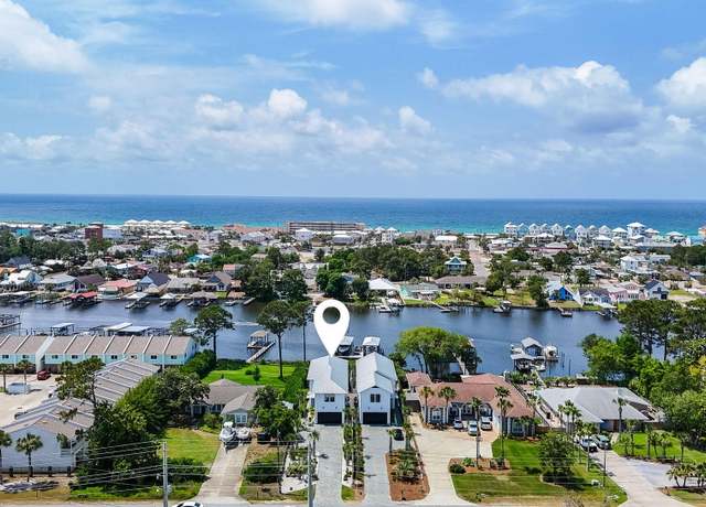 Property at 8597 N Lagoon Dr, Panama City, FL 32408, 4 beds, 3.5 baths