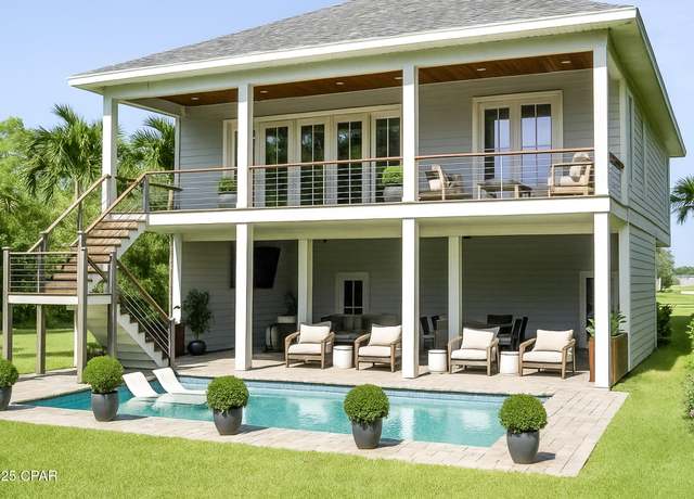 Property at 8801 N Lagoon Dr, Panama City Beach, FL 32408, 3 beds, 3.5 baths