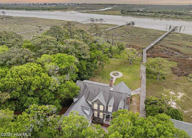 Property at 715 Shoreline Dr W, Sunset Beach, NC 28468, 5 beds, 3.5 baths