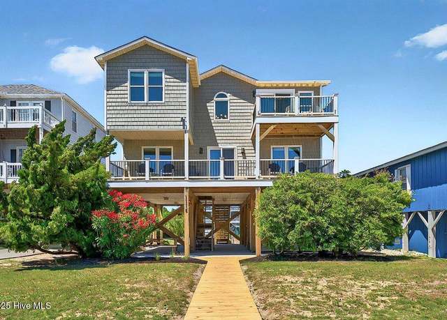 Property at 1116 E Beach Dr, Oak Island, NC 28465, 4 beds, 3 baths