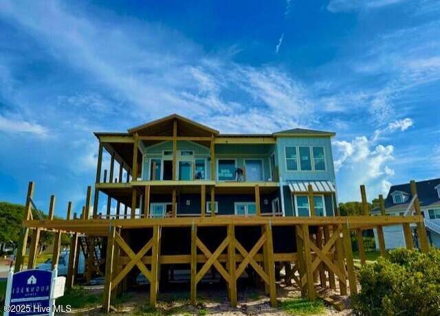 Property at 102 Ocean Dr, Oak Island, NC 28465, 7 beds, 7 baths