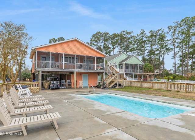 Property at 1402 W Yacht Dr, Oak Island, NC 28465, 7 beds, 4 baths