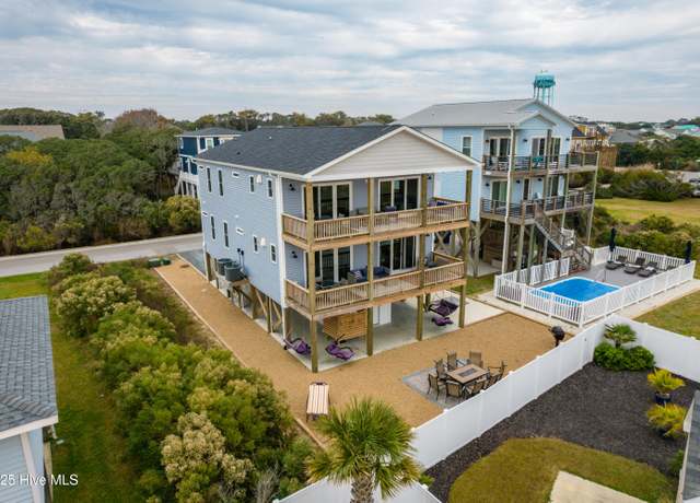 Property at 5205 E Pelican Dr, Oak Island, NC 28465, 6 beds, 6 baths