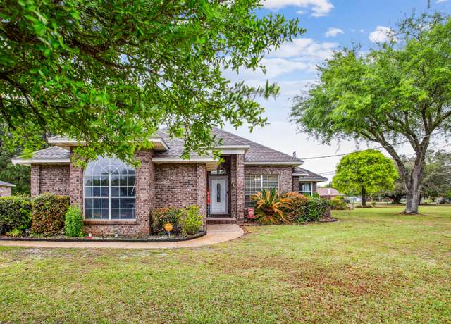 Property at 1861 Sparrow Ln, Navarre, FL 32566, 3 beds, 2 baths